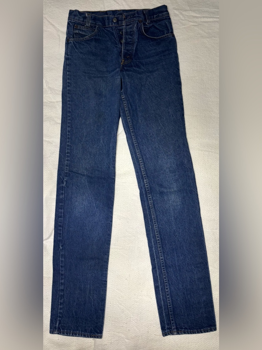 Vintage Levi's Indigo Blue Denim Jeans with Tan Leather Patch and orange tag
